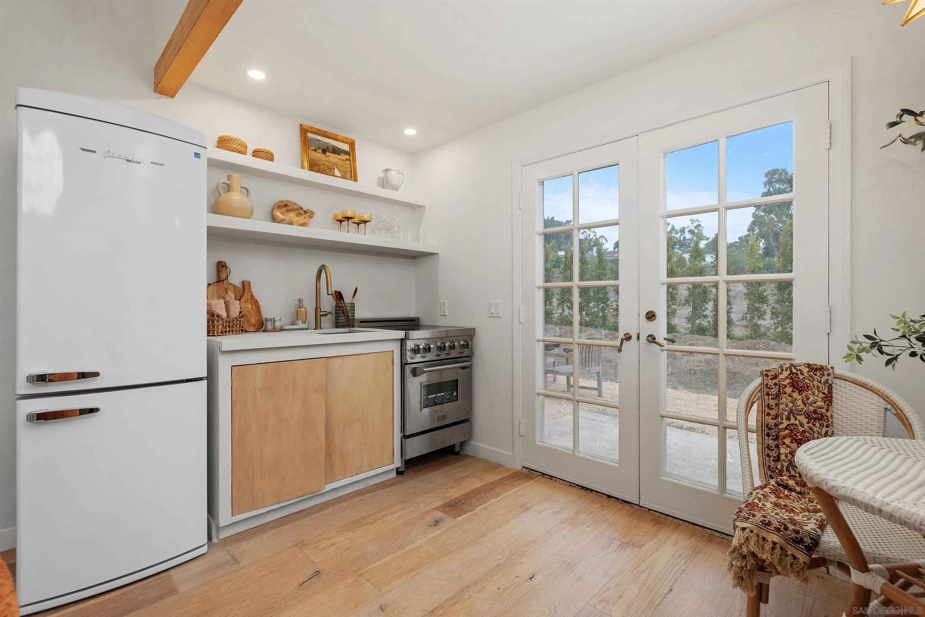 6631 Lago Lindo Rancho Santa Fe, CA 92067 - Photo 6 of 14 a kitchen with stainless steel appliances a stove a sink and a refrigerator