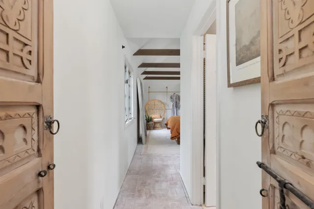 a view of a hallway with washer and dryer