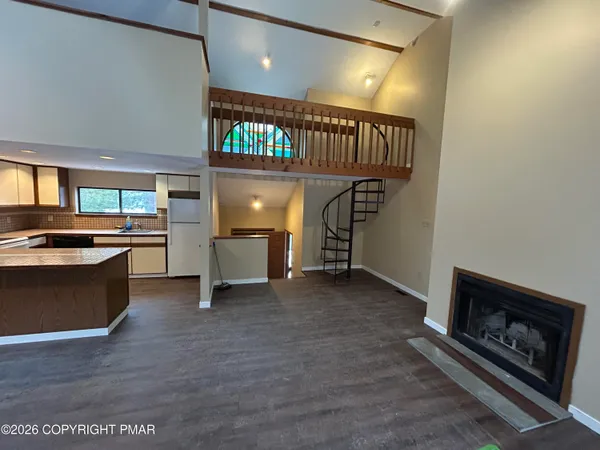 a open kitchen with a sink and a stove
