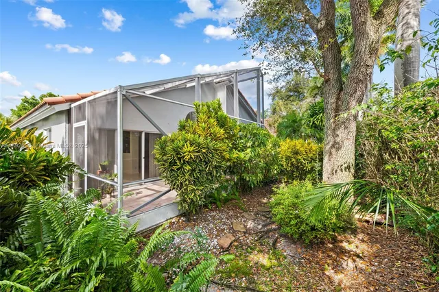 a house with a tree in front of it