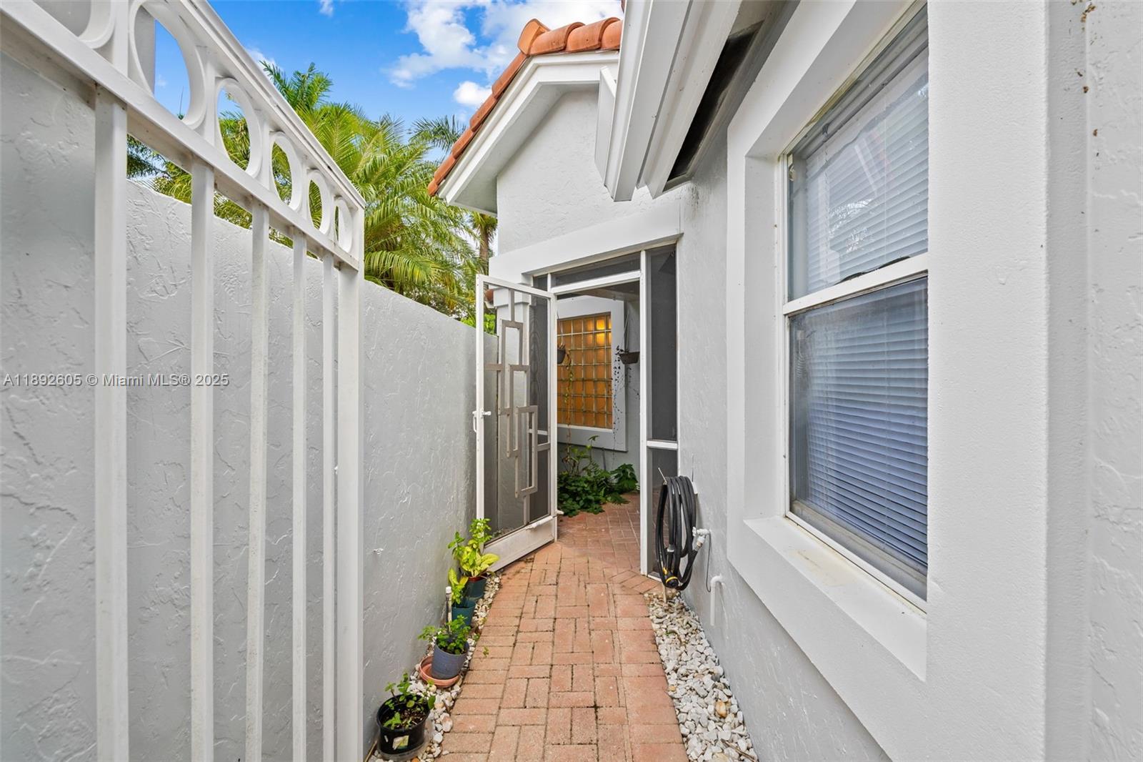 9650 Harbour Lake Circle Boynton Beach, FL 33437 - Photo 23 of 25 a view of a house with a balcony