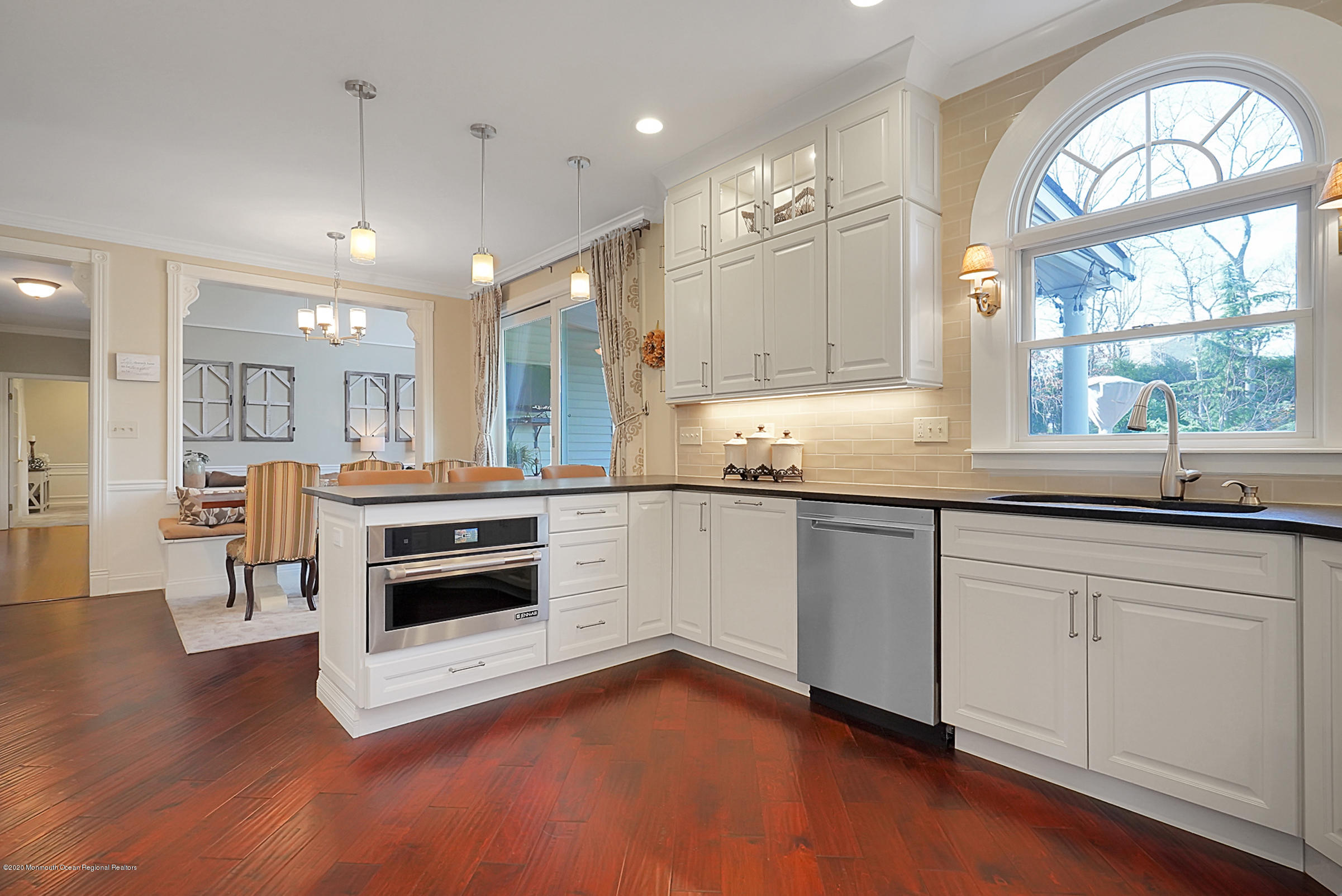 2411 Apple Ridge Circle Manasquan, NJ 08736 - Photo 11 of 37 a kitchen with stainless steel appliances granite countertop a stove a sink and a microwave
