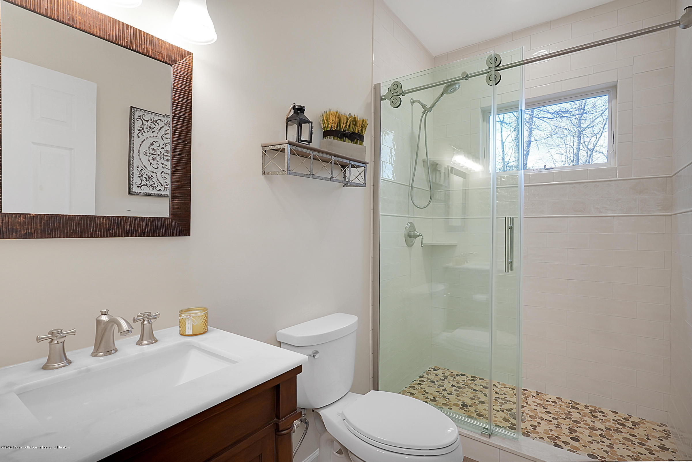 2411 Apple Ridge Circle Manasquan, NJ 08736 - Photo 13 of 37 a bathroom with a sink toilet and shower
