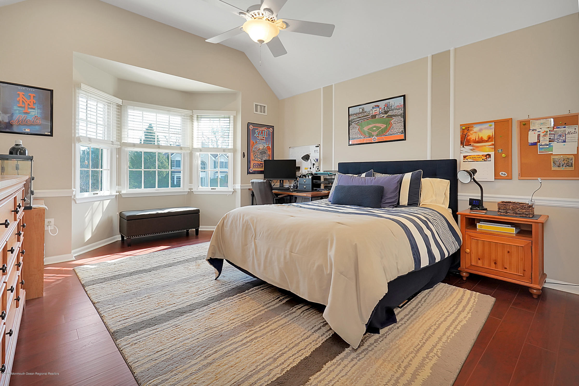 2411 Apple Ridge Circle Manasquan, NJ 08736 - Photo 17 of 37 a spacious bedroom with a bed and wooden floor