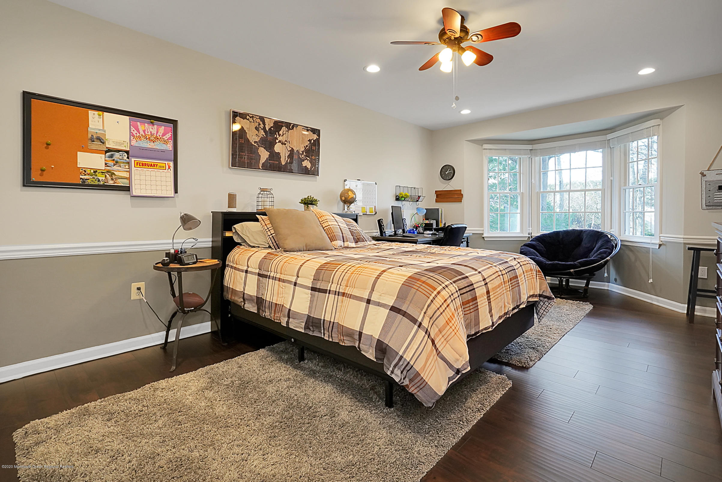 2411 Apple Ridge Circle Manasquan, NJ 08736 - Photo 18 of 37 a bedroom with a bed and glass door