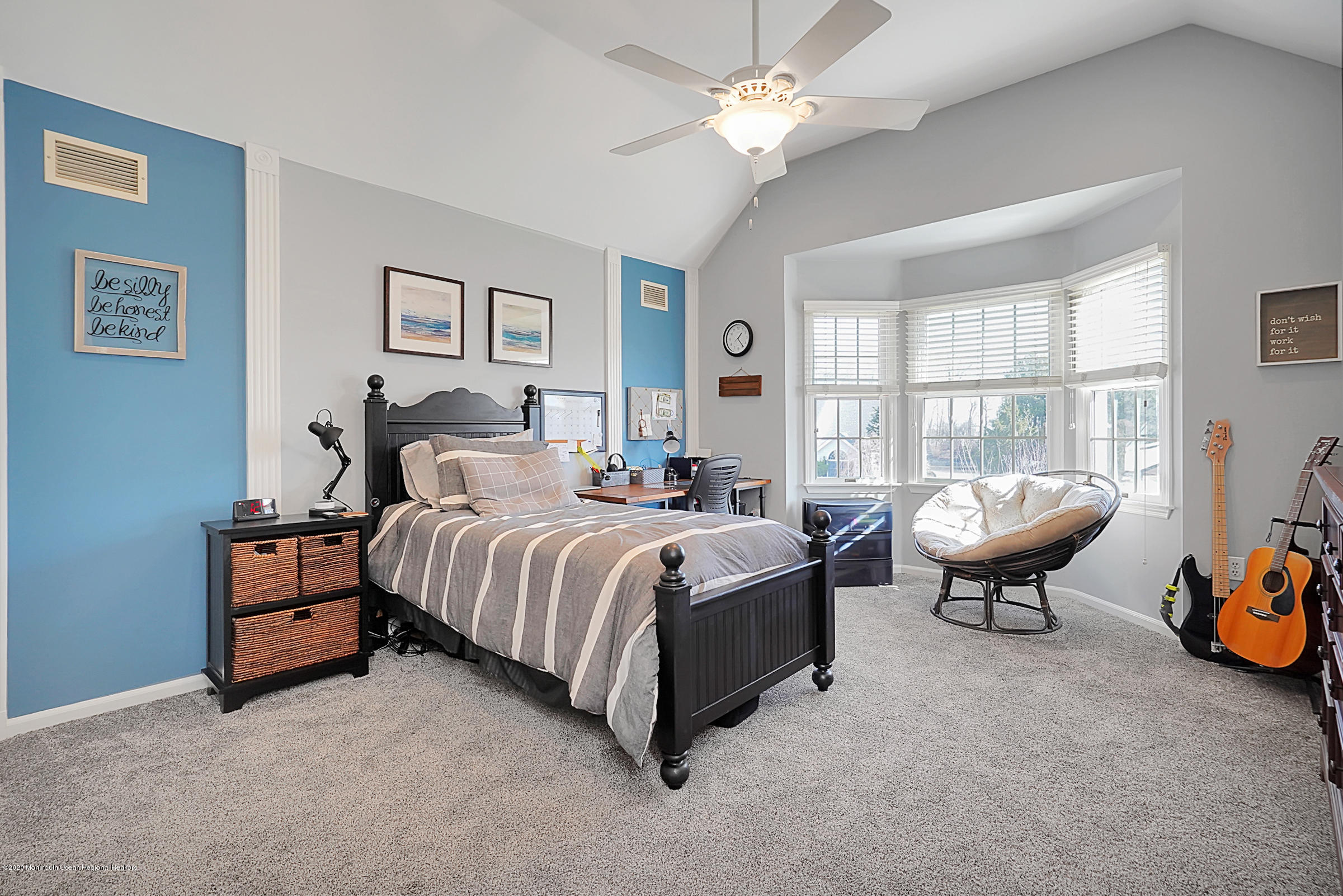 2411 Apple Ridge Circle Manasquan, NJ 08736 - Photo 21 of 37 a spacious bedroom with a bed and a chandelier
