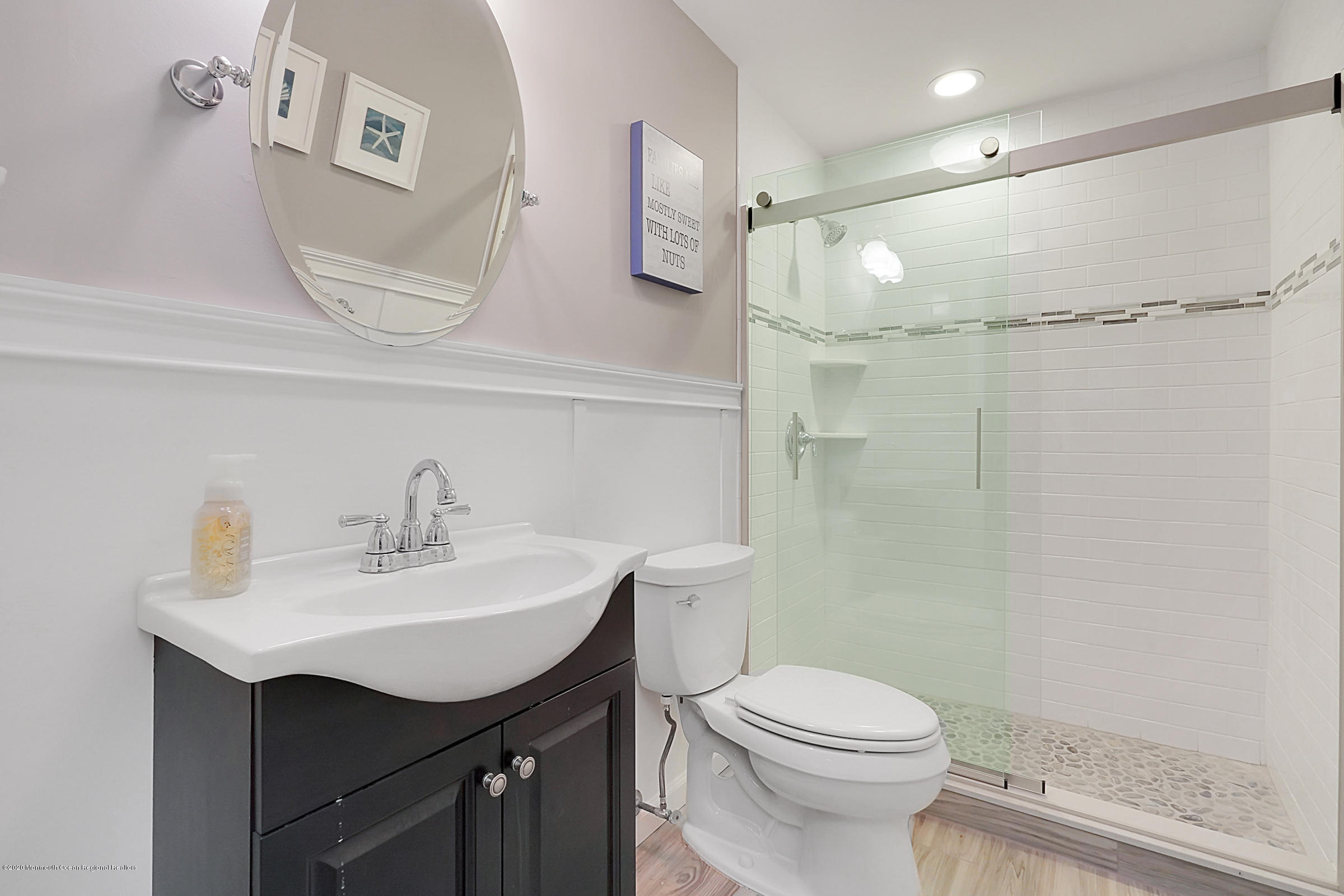 2411 Apple Ridge Circle Manasquan, NJ 08736 - Photo 28 of 37 a bathroom with a sink a toilet and shower