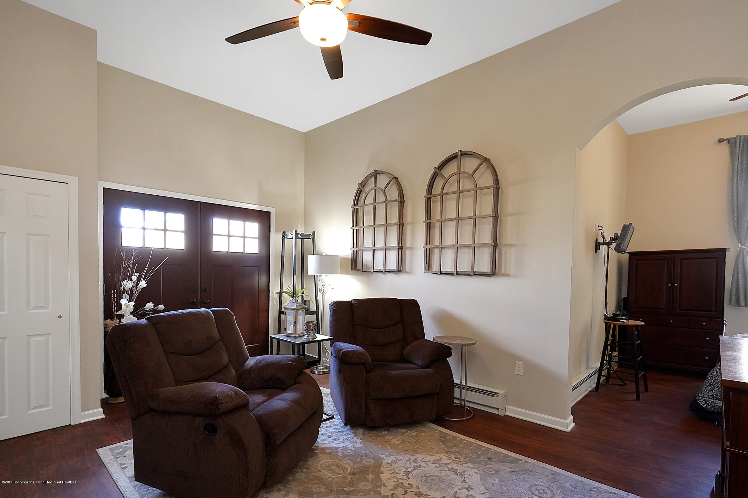 2411 Apple Ridge Circle Manasquan, NJ 08736 - Photo 29 of 37 a living room with furniture and a mirror