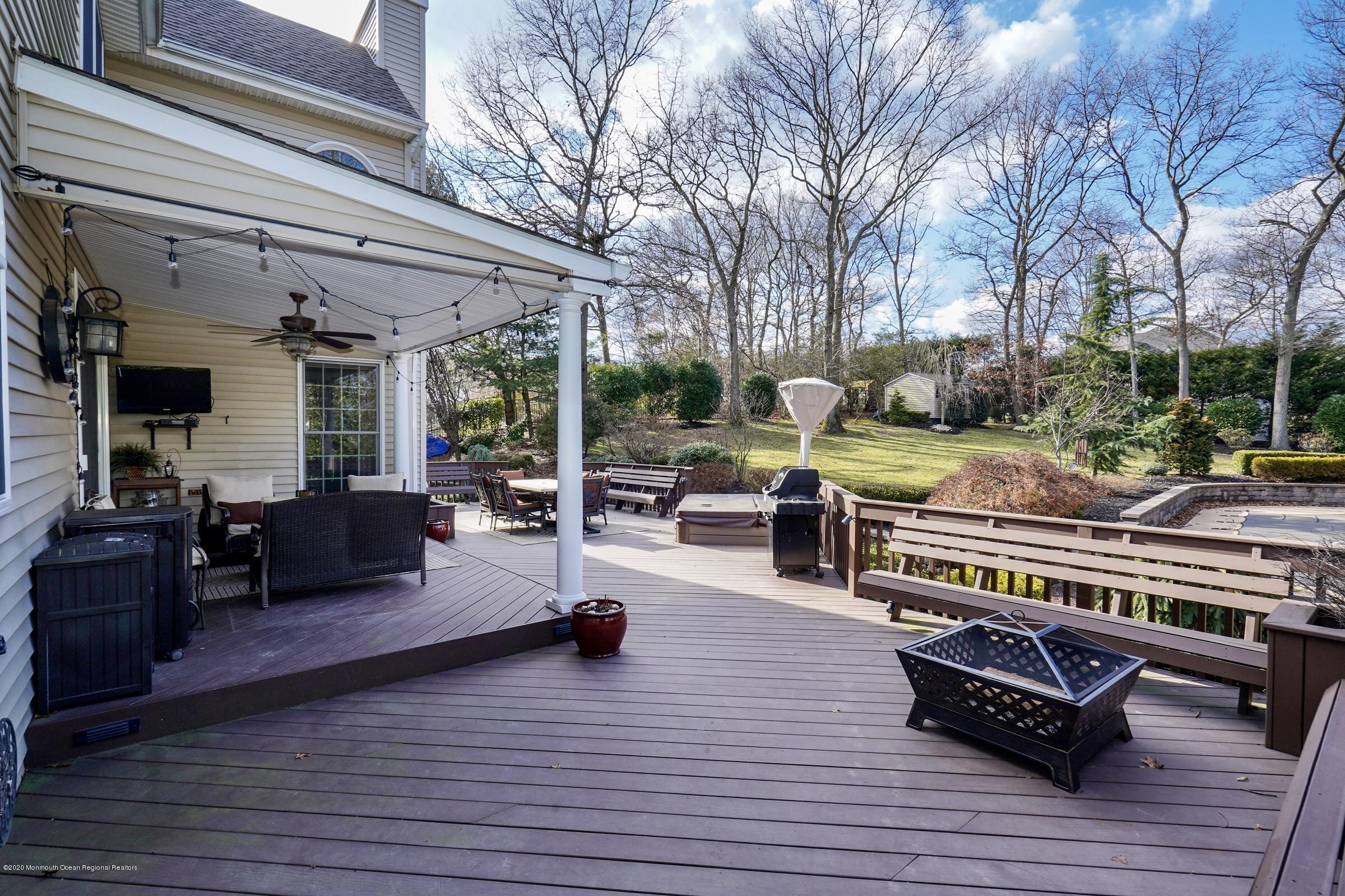 2411 Apple Ridge Circle Manasquan, NJ 08736 - Photo 32 of 37 a outdoor living space with furniture and wooden floor