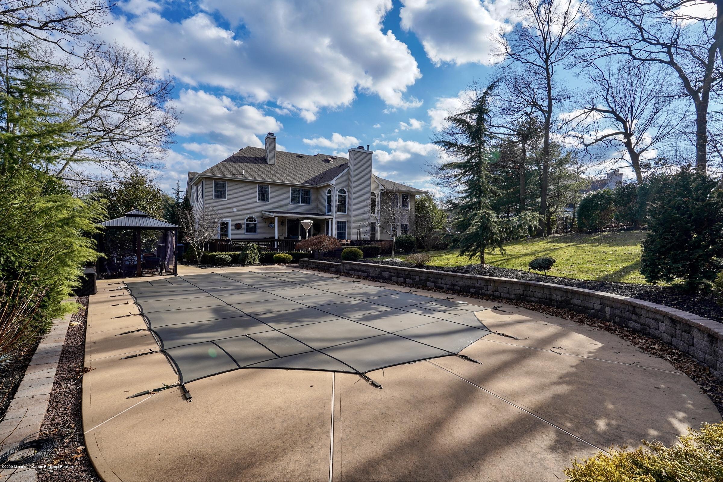 2411 Apple Ridge Circle Manasquan, NJ 08736 - Photo 34 of 37 a view of yard with swimming pool and furniture
