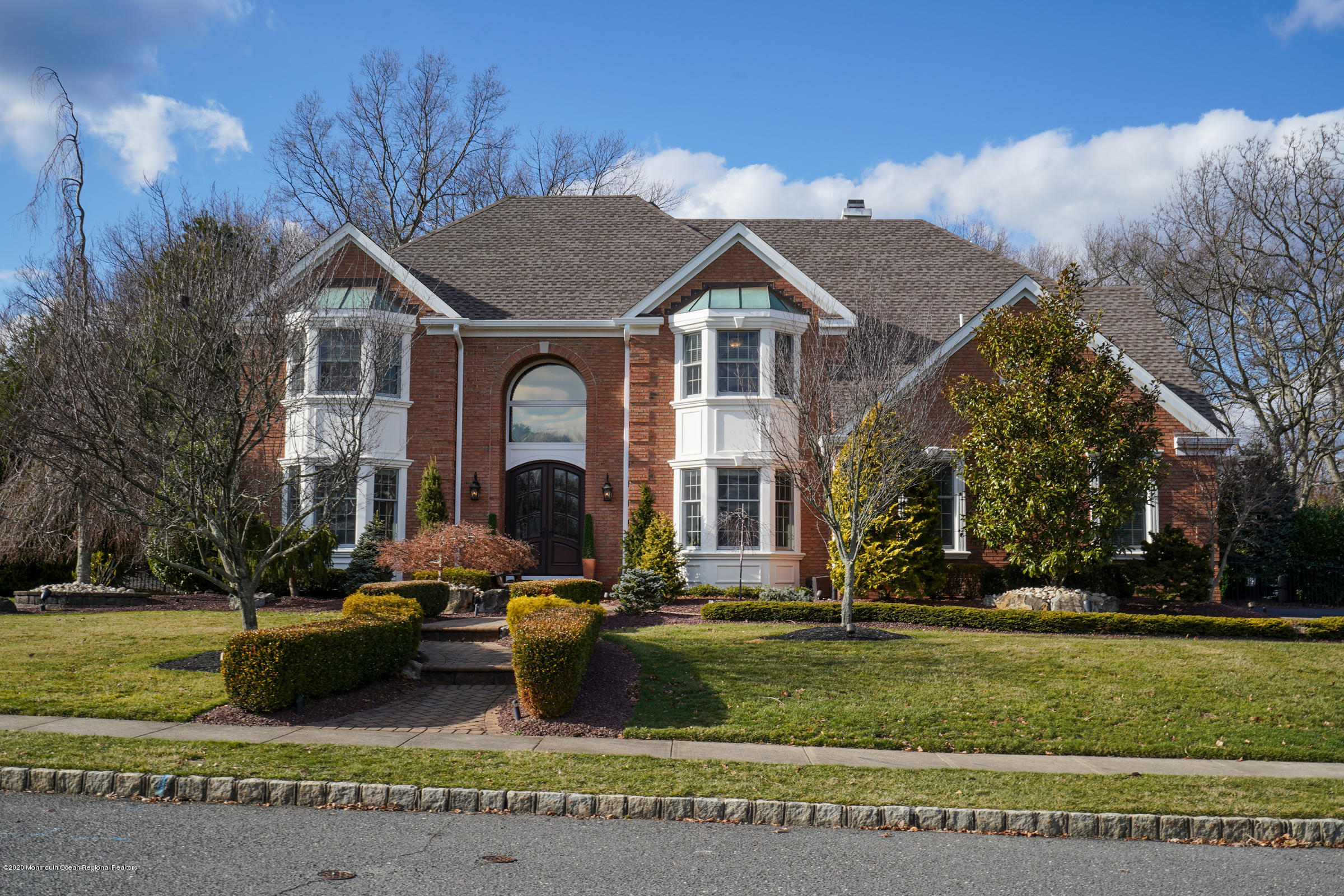 2411 Apple Ridge Circle Manasquan, NJ 08736 - Photo 37 of 37 a front view of a house with a yard