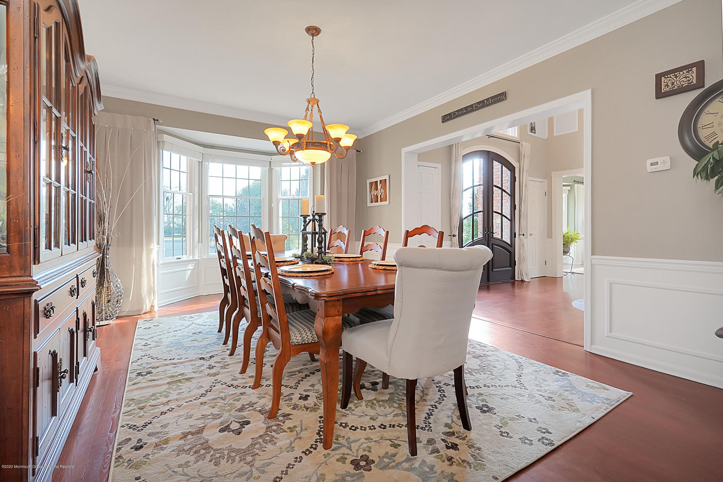 2411 Apple Ridge Circle Manasquan, NJ 08736 - Photo 7 of 37 a view of a dining room with furniture window and wooden floor