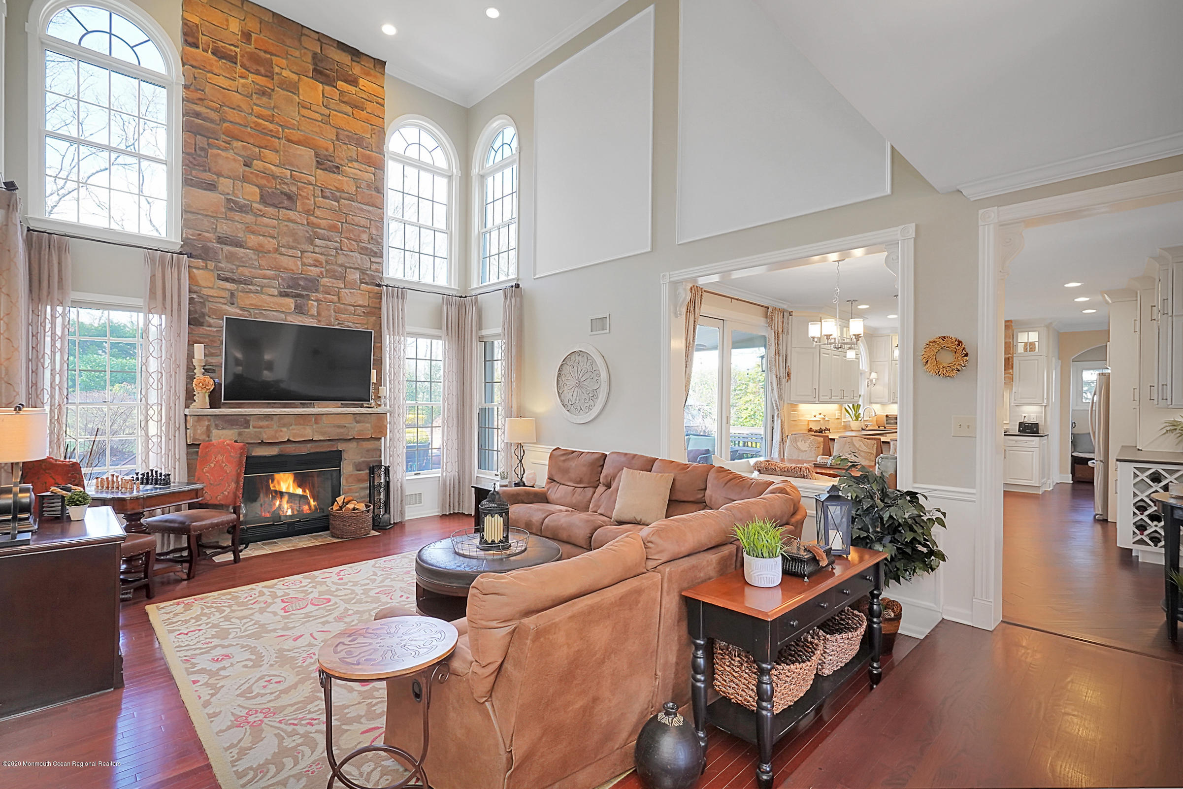 2411 Apple Ridge Circle Manasquan, NJ 08736 - Photo 8 of 37 a living room with fireplace furniture and a flat screen tv