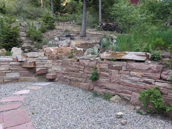 a backyard of a house with outdoor seating