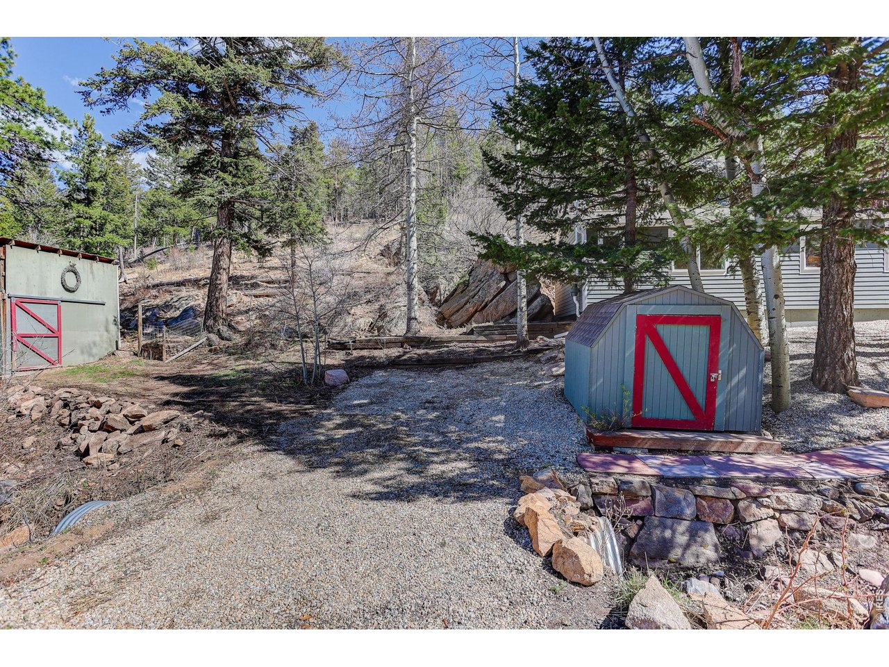 11826 Brook Road Golden, CO 80403 - Photo 27 of 28 Parking Pad #2 to Shed (Right) and Rustic Barn w Hay Loft (Left)