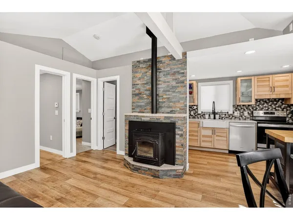 a view of a livingroom with furniture and a fireplace