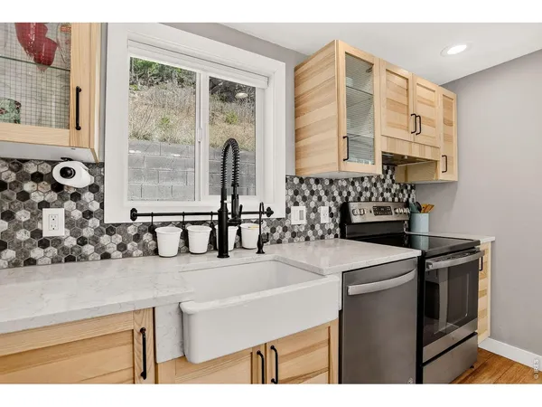 a kitchen with a sink and a refrigerator