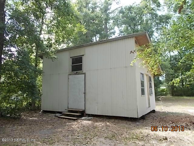 96539 Blackrock Road Yulee, FL 32097 - Photo 15 of 26 a backyard of a house