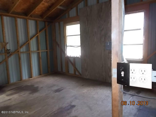 96539 Blackrock Road Yulee, FL 32097 - Photo 16 of 26 a view of an empty room with a window
