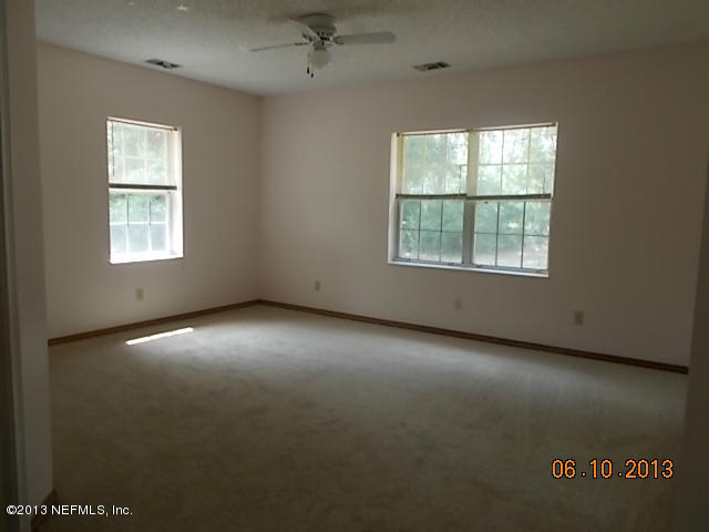 96539 Blackrock Road Yulee, FL 32097 - Photo 19 of 26 an empty room with a window