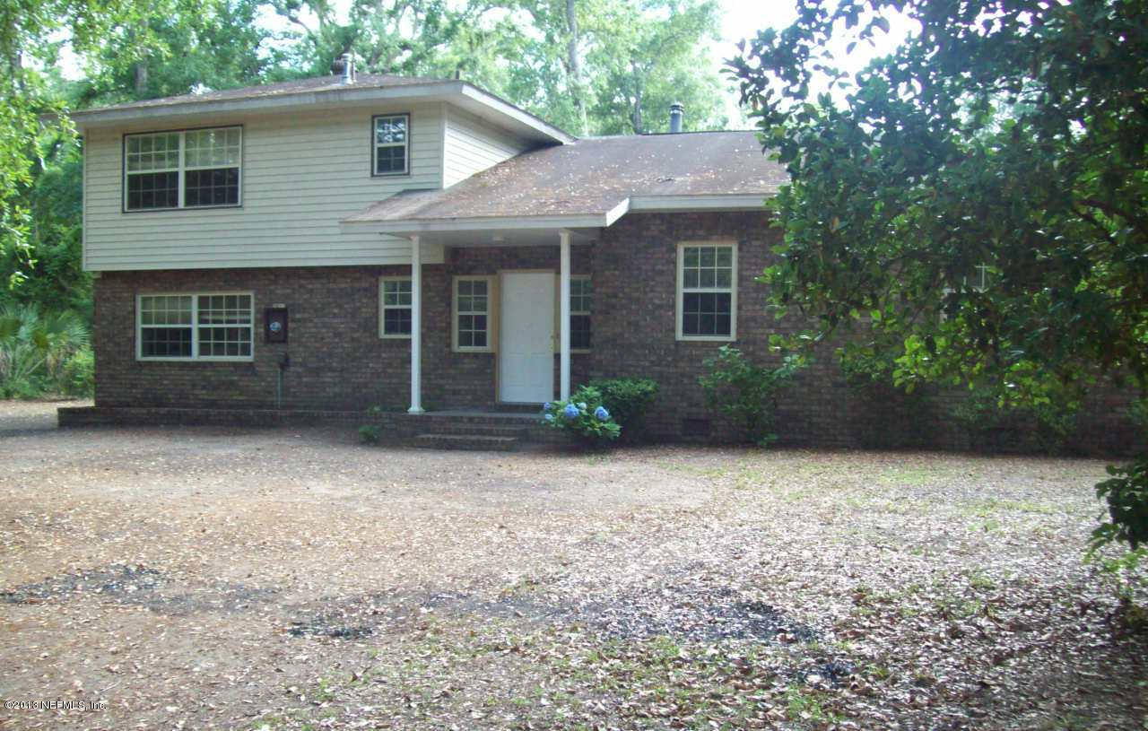 96539 Blackrock Road Yulee, FL 32097 - Photo 2 of 26 front view of a house with a trees