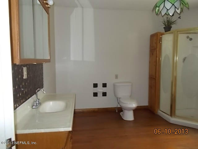 96539 Blackrock Road Yulee, FL 32097 - Photo 21 of 26 a bathroom with a sink toilet and shower