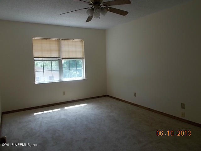96539 Blackrock Road Yulee, FL 32097 - Photo 26 of 26 an empty room with a window