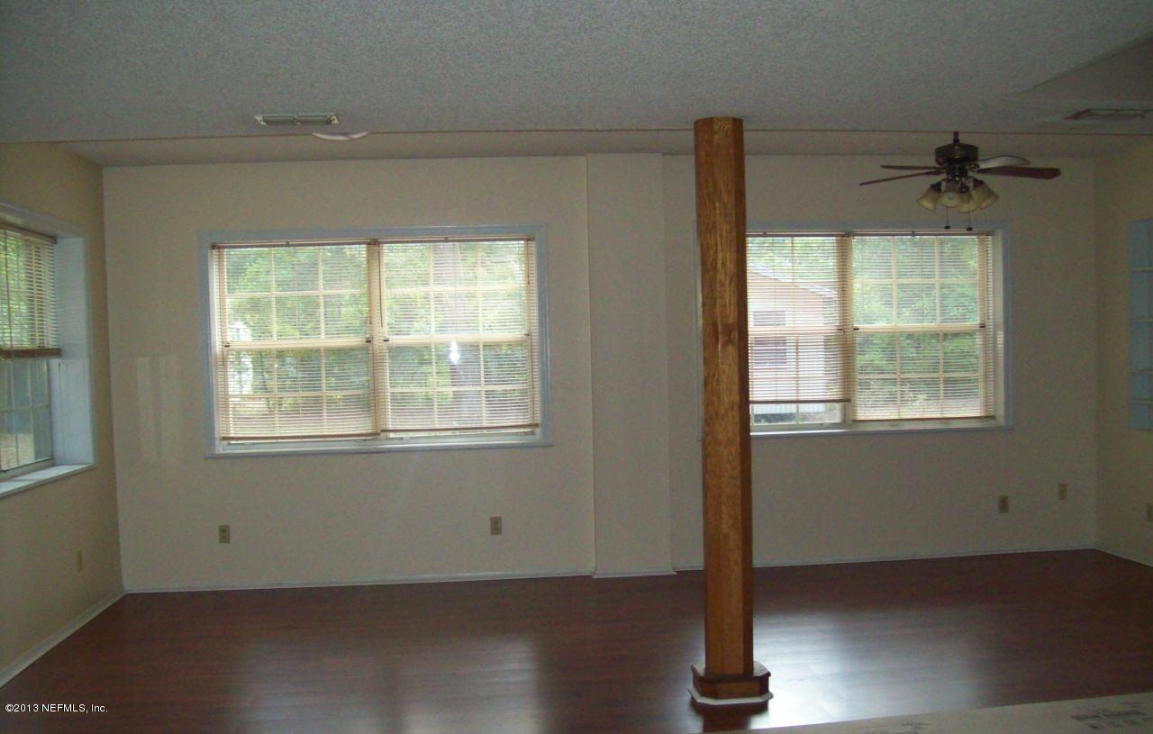 96539 Blackrock Road Yulee, FL 32097 - Photo 6 of 26 a view of an empty room with a window
