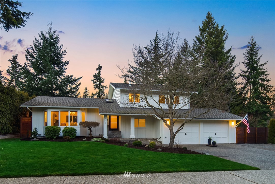 3713 98th Street Southeast Everett, WA 98208 - Photo 1 of 38 a front view of a house with a garden