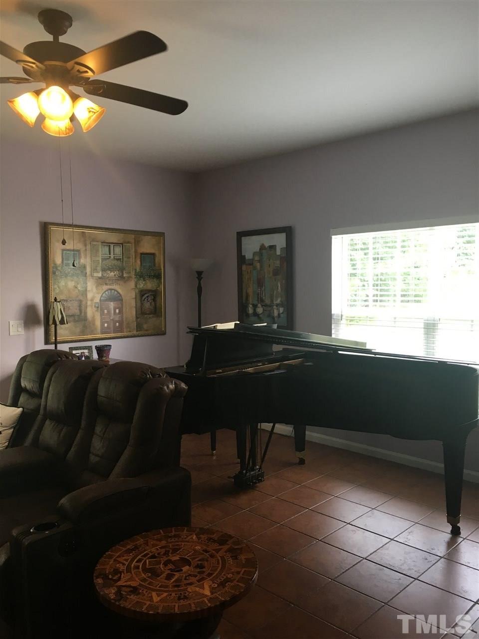 2614 Wyntercrest Lane Durham, NC 27713 - Photo 13 of 19 a living room with furniture and a window
