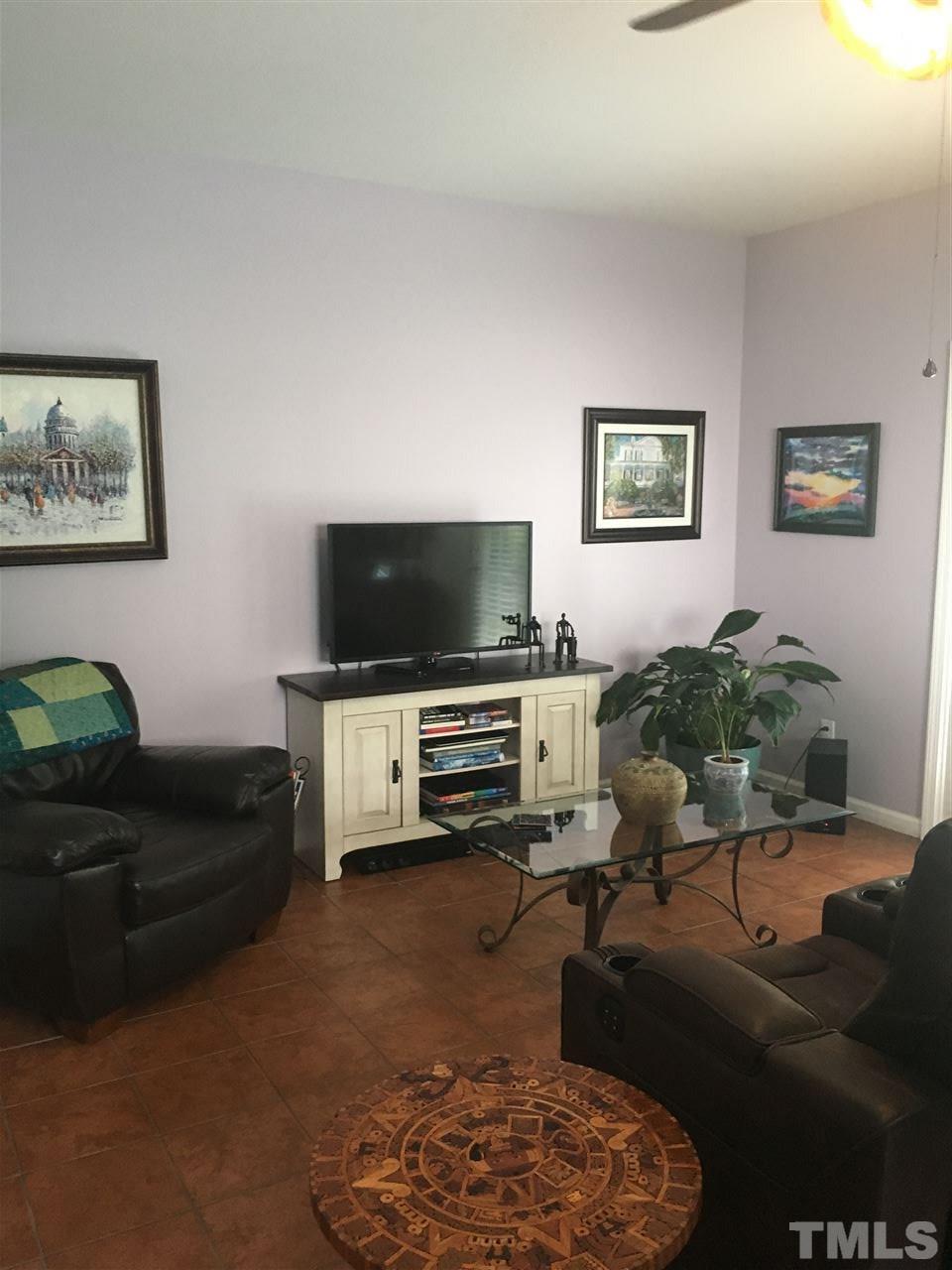 2614 Wyntercrest Lane Durham, NC 27713 - Photo 14 of 19 a living room with furniture and a flat screen tv
