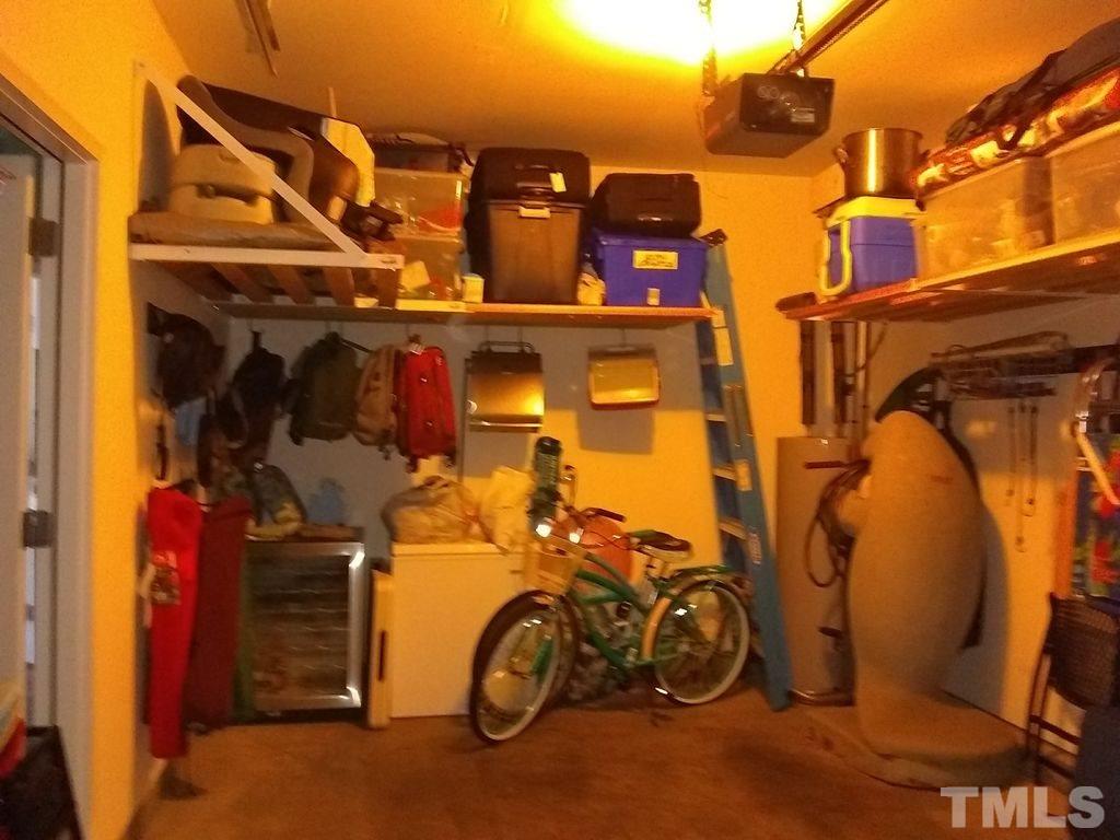 2614 Wyntercrest Lane Durham, NC 27713 - Photo 17 of 19 a view of a garage with parked cars