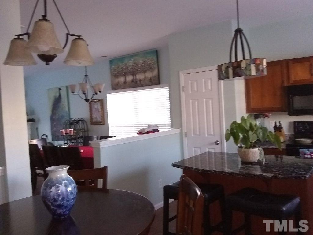 2614 Wyntercrest Lane Durham, NC 27713 - Photo 18 of 19 a dining room with furniture and window