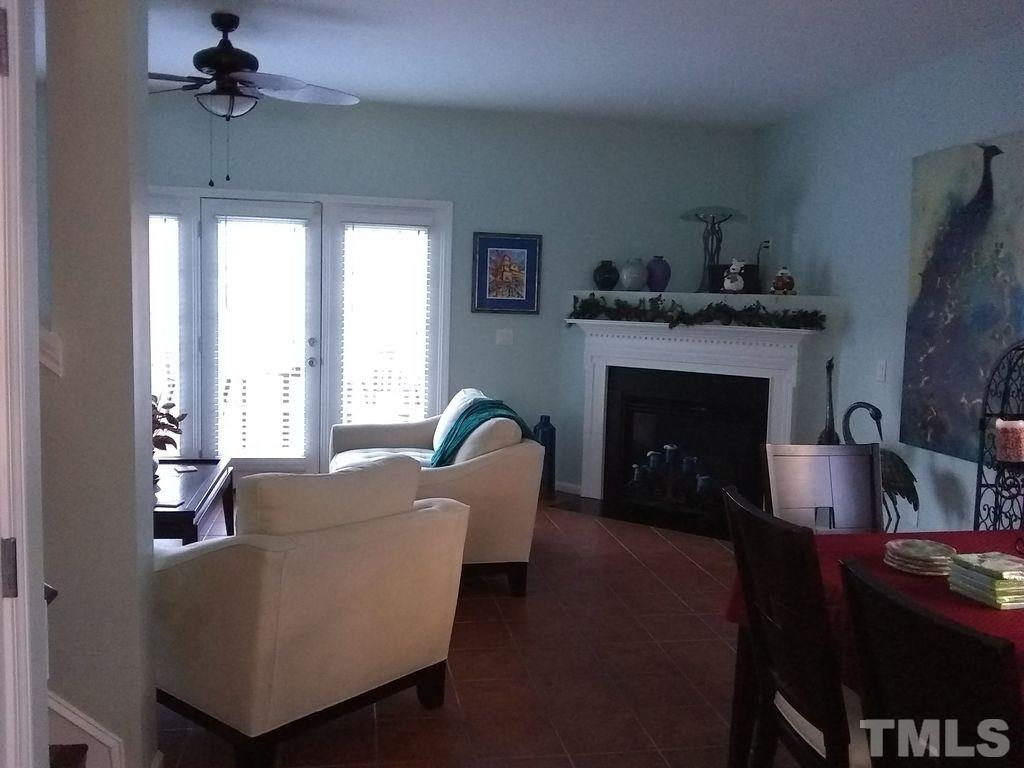 2614 Wyntercrest Lane Durham, NC 27713 - Photo 19 of 19 a living room with furniture and a fireplace
