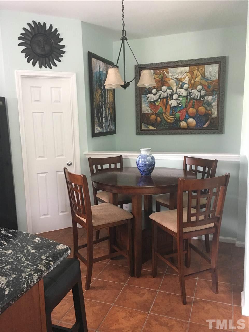 2614 Wyntercrest Lane Durham, NC 27713 - Photo 3 of 19 a dining room with furniture and window