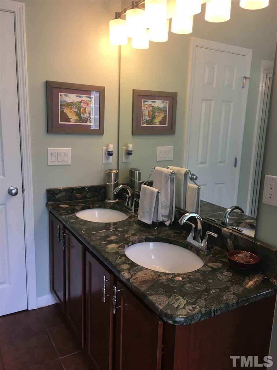 2614 Wyntercrest Lane Durham, NC 27713 - Photo 9 of 19 a sink and a mirror