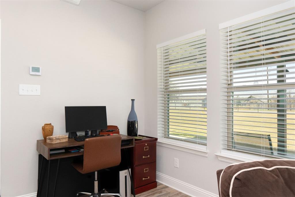 849 County Road 4764 Boyd, TX 76023 - Photo 33 of 40 a view of a workspace with furniture and a window
