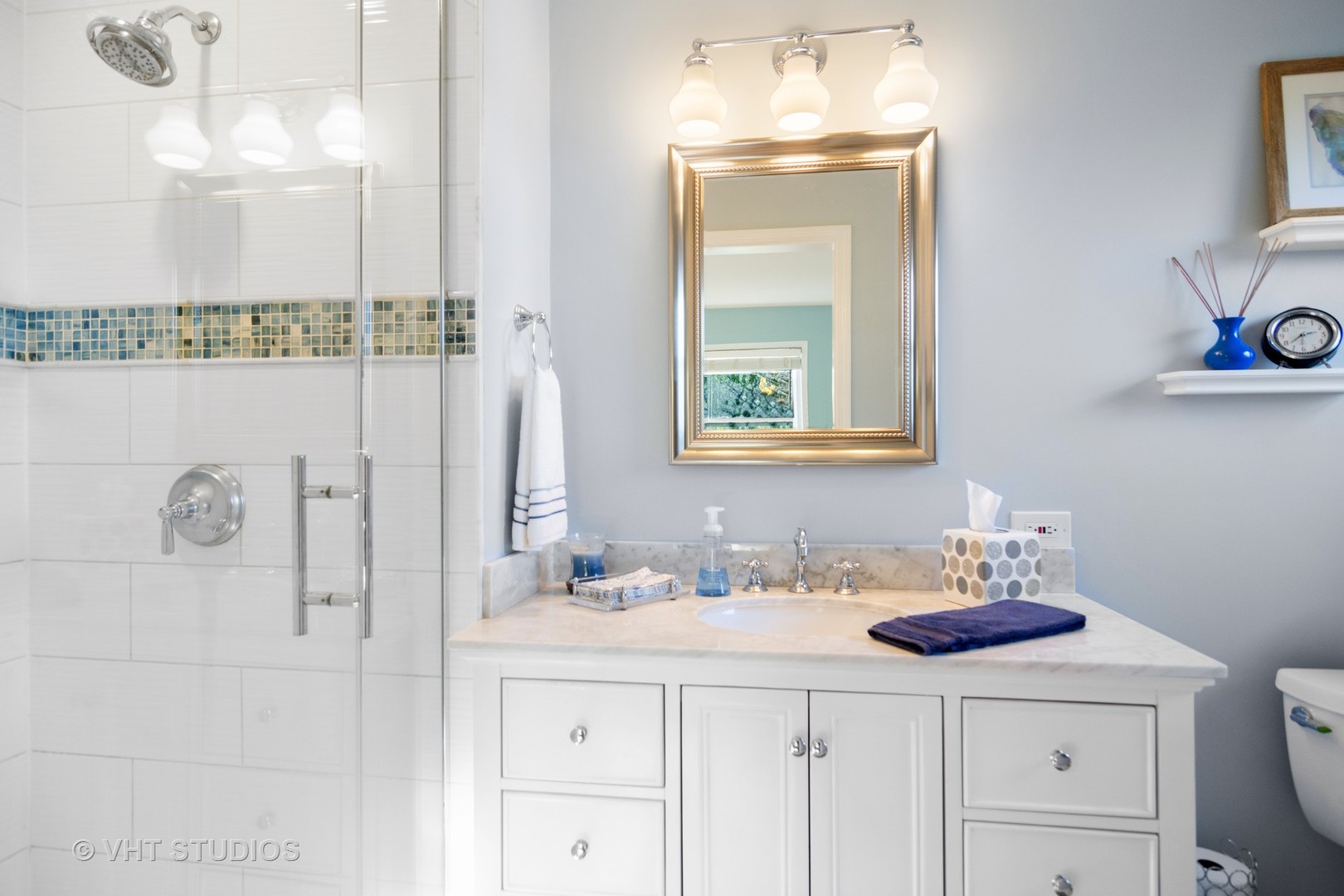1857 Thomas Atkinson Road Inverness, IL 60067 - Photo 19 of 40 a bathroom with a sink vanity and a mirror