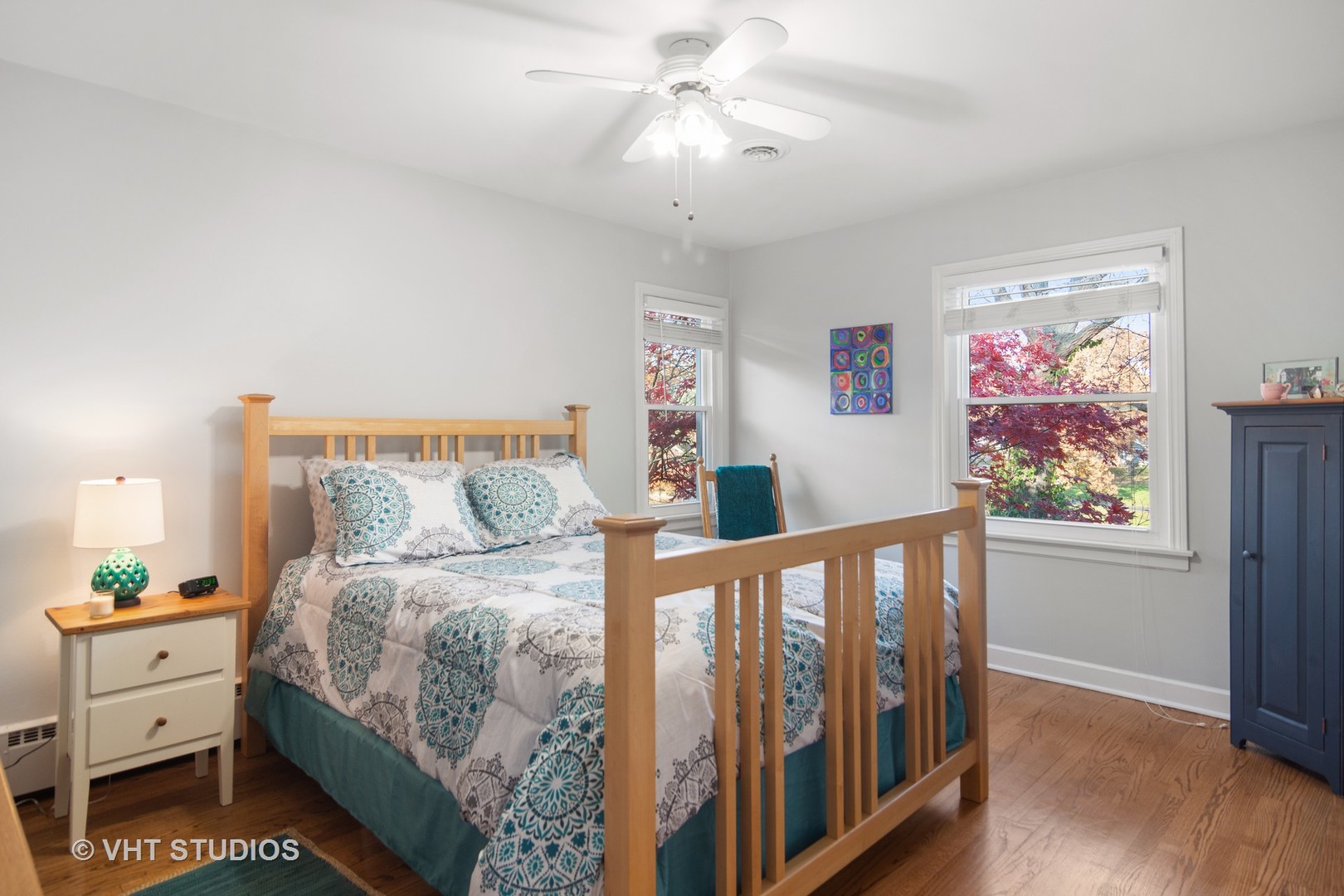 1857 Thomas Atkinson Road Inverness, IL 60067 - Photo 22 of 40 a bedroom with a bed and a chandelier