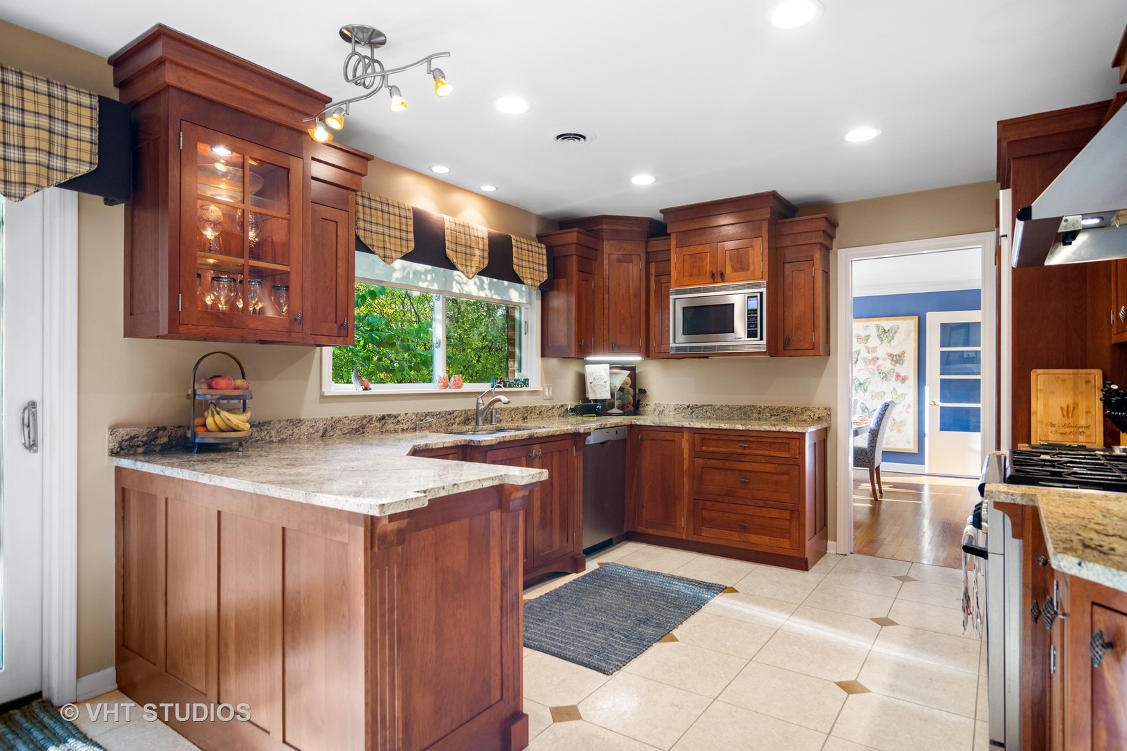 1857 Thomas Atkinson Road Inverness, IL 60067 - Photo 9 of 40 a kitchen with a sink stove top oven and cabinets
