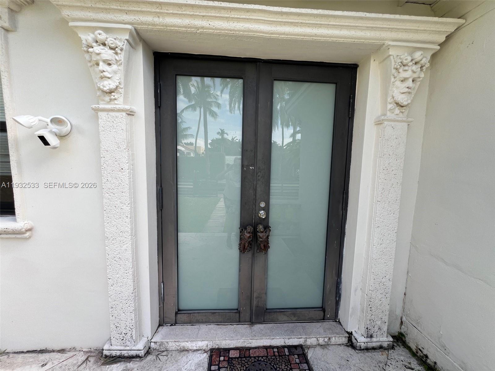 4575 Post Avenue Miami Beach, FL 33140 - Photo 12 of 57 a view of a entryway door