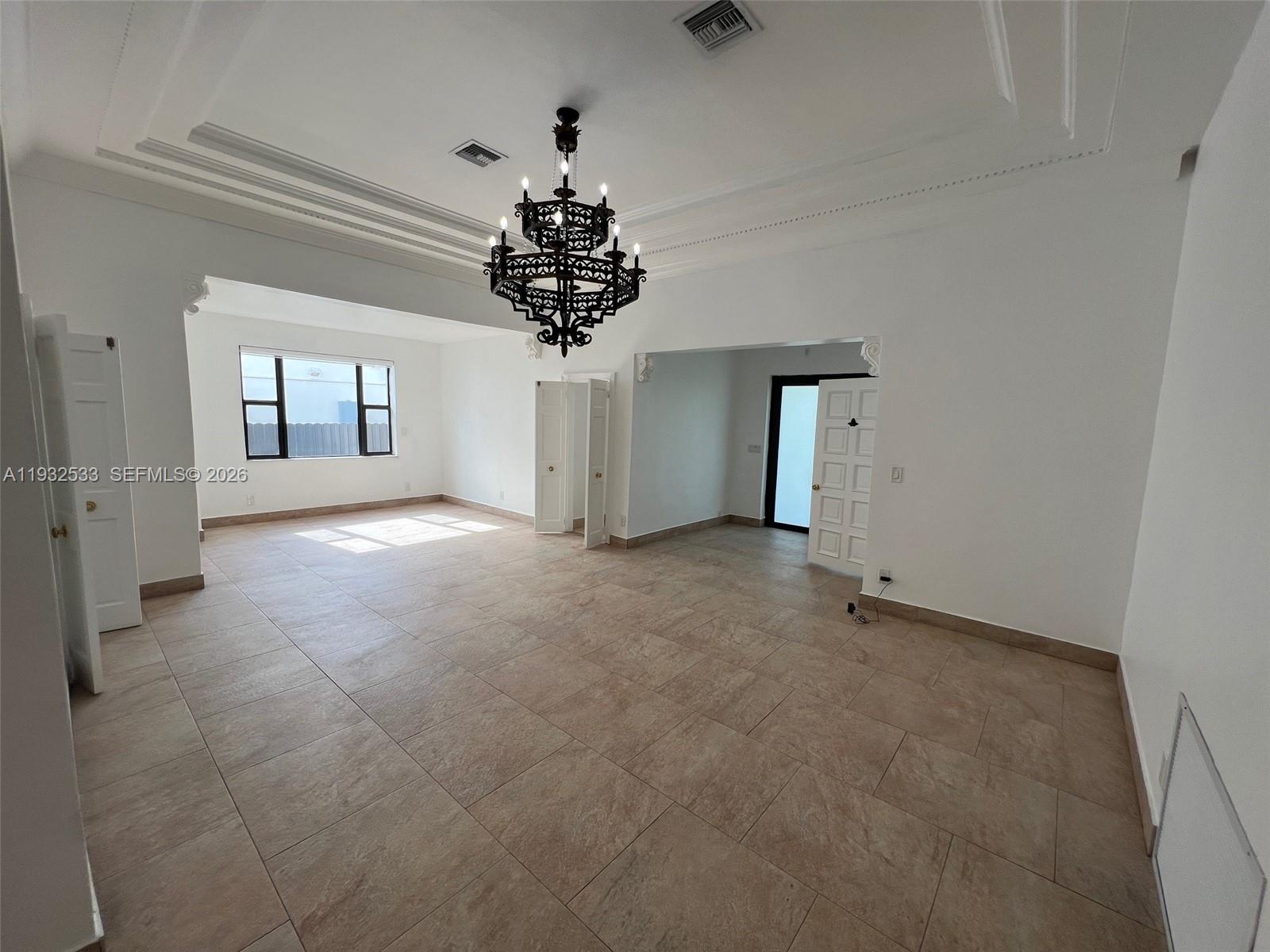 4575 Post Avenue Miami Beach, FL 33140 - Photo 19 of 57 wooden floor in an empty room with a window