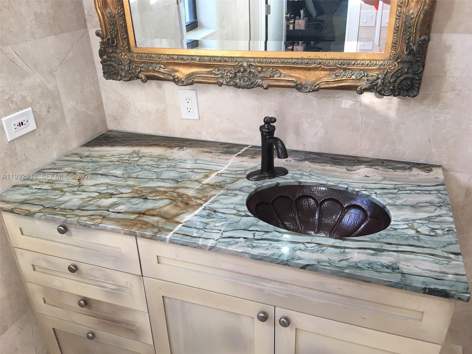 4575 Post Avenue Miami Beach, FL 33140 - Photo 28 of 57 a kitchen with a stove and cabinets