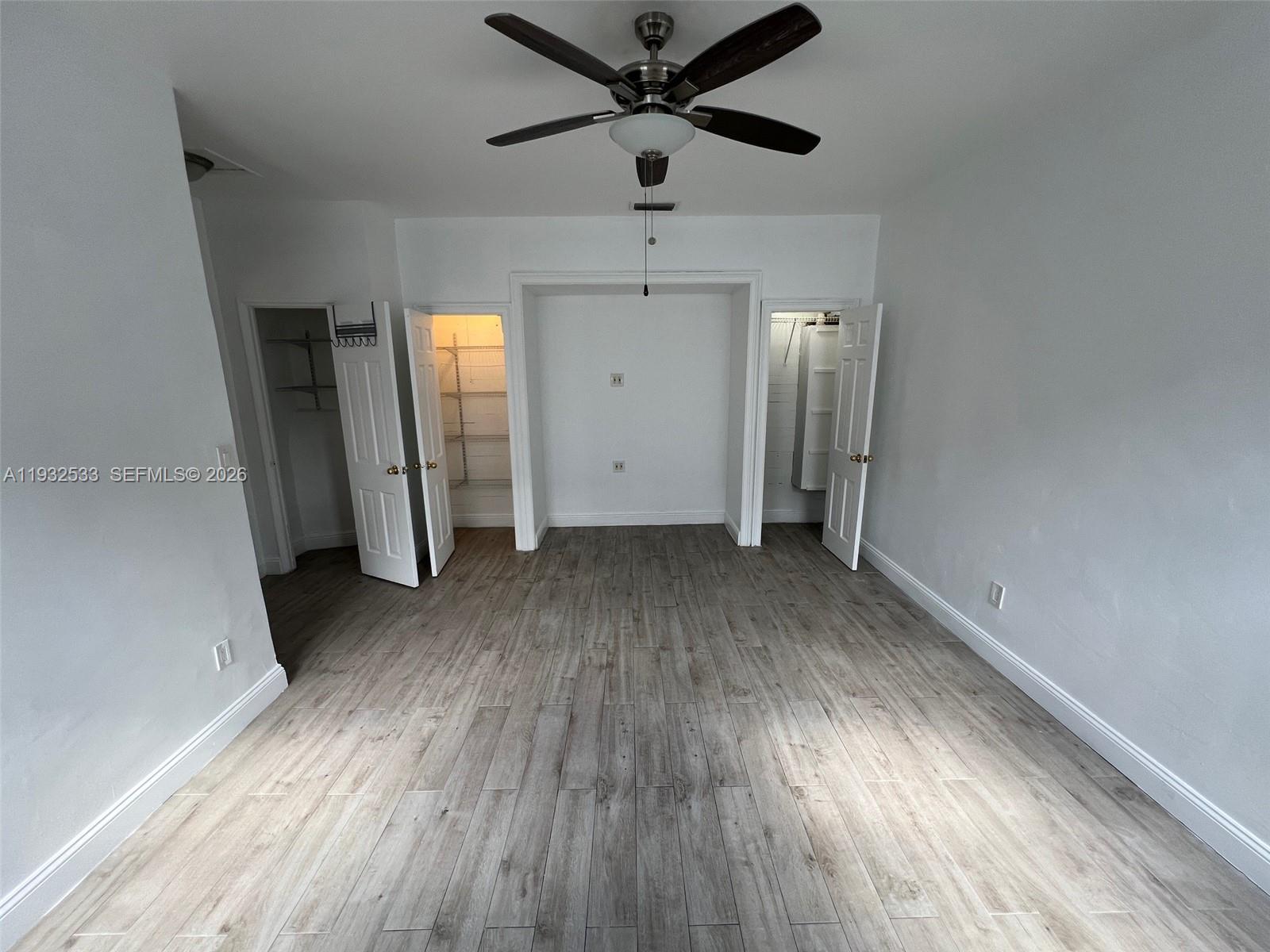 4575 Post Avenue Miami Beach, FL 33140 - Photo 42 of 57 wooden floor in an empty room with a window