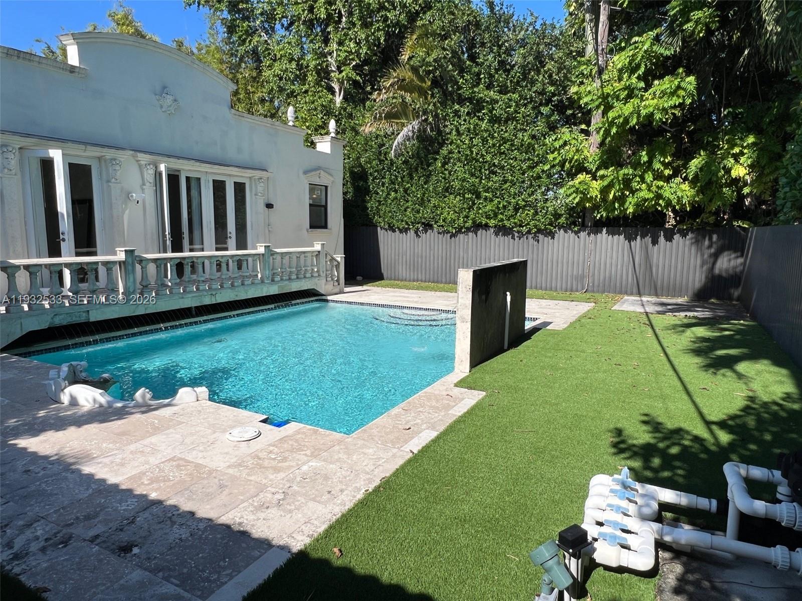 4575 Post Avenue Miami Beach, FL 33140 - Photo 49 of 57 a view of a backyard with sitting area