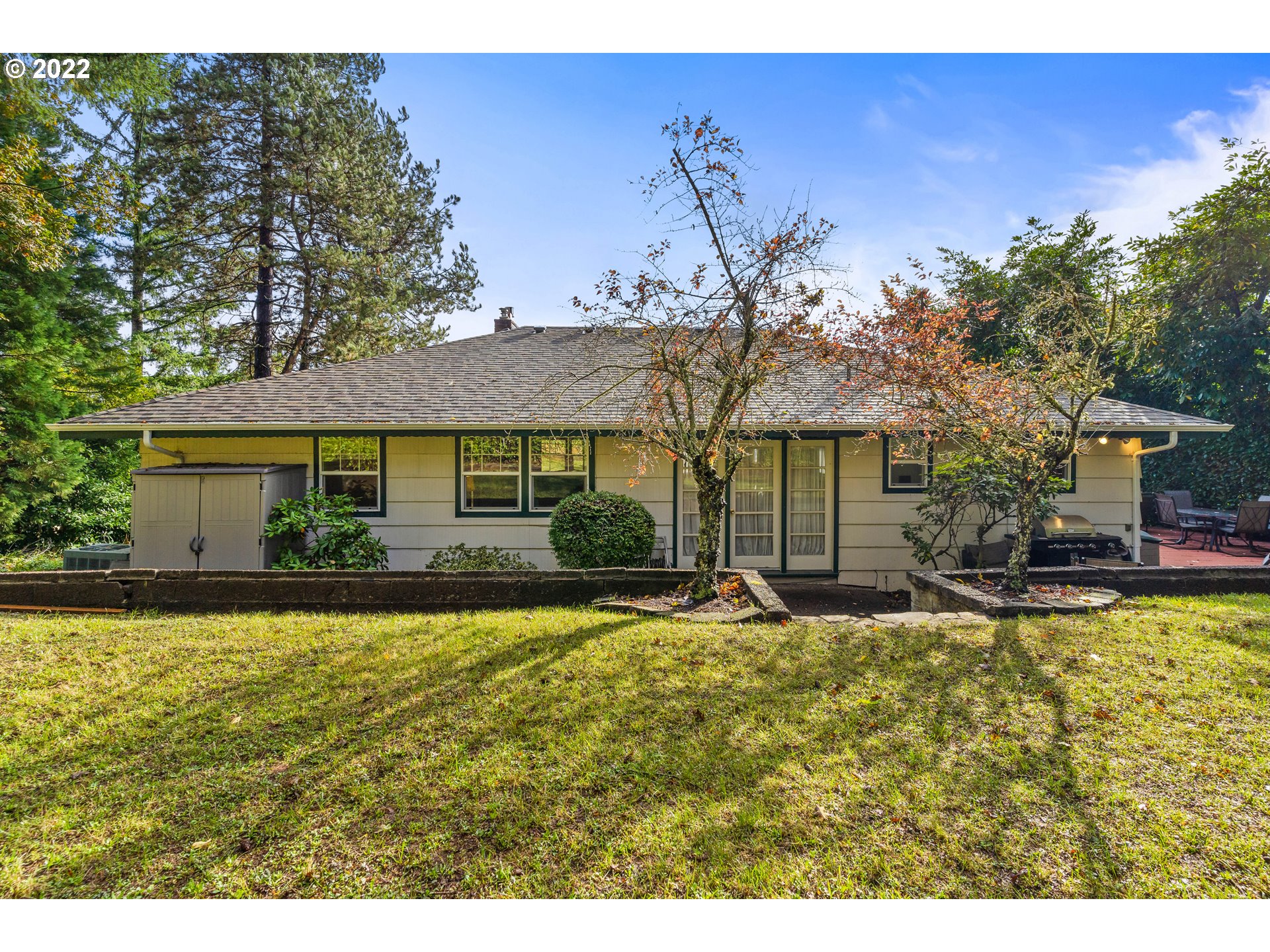 3395 Liberty Road South Salem, OR 97302 - Photo 30 of 32 a front view of a house with a yard outdoor seating and covered with trees