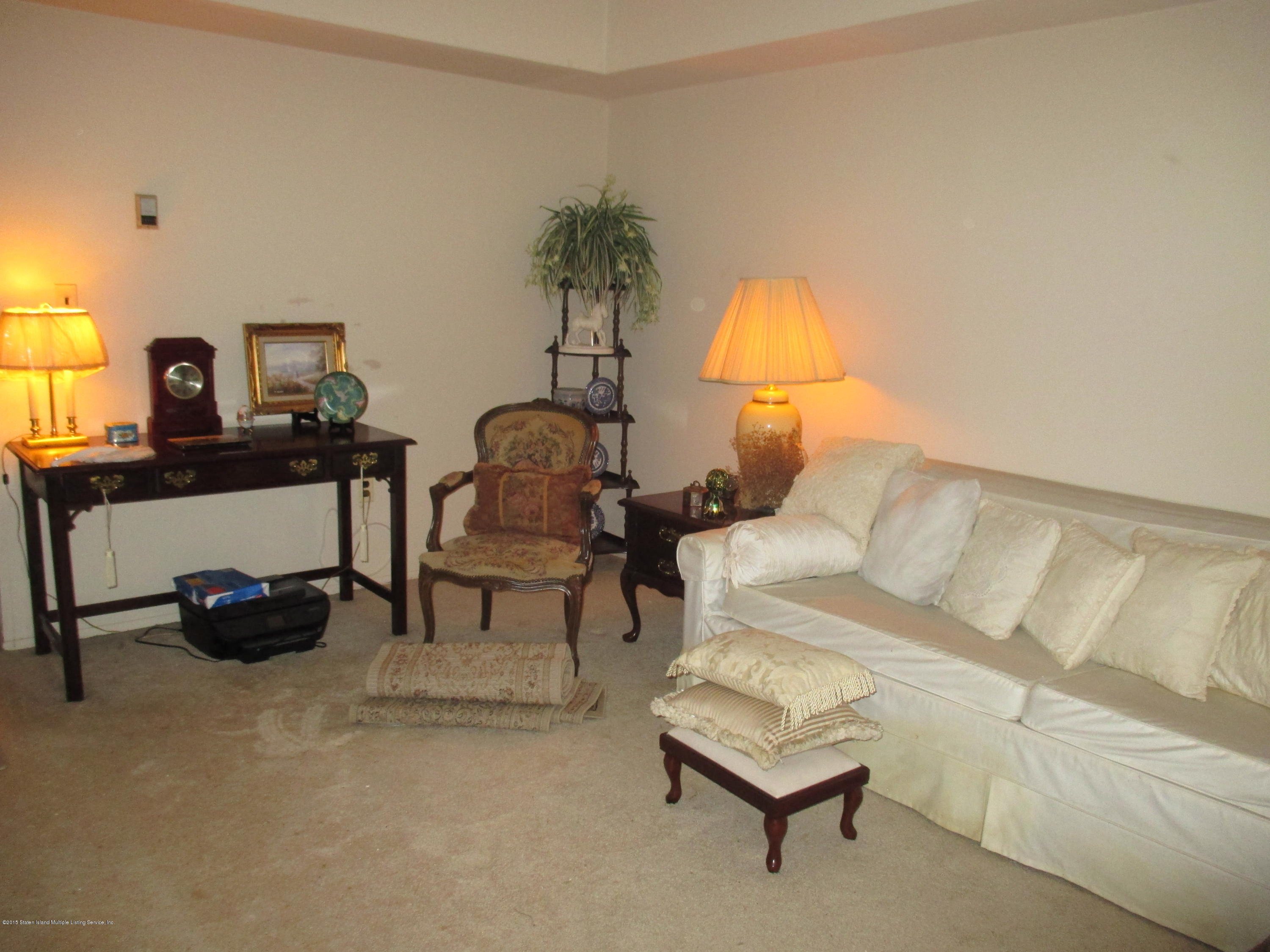 83 Narrows Road North, Unit 2D Staten Island, NY 10305 - Photo 7 of 16 LR w L sofa & desk