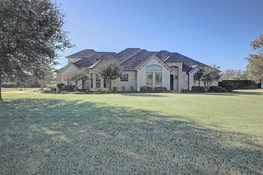 3705 Canyon Pass Trail Burleson, TX 76028 - Photo 1 of 32 a view of a big house with a big yard and palm trees