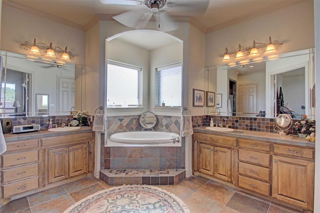3705 Canyon Pass Trail Burleson, TX 76028 - Photo 14 of 32 a bathroom with a double vanity sink and a mirror