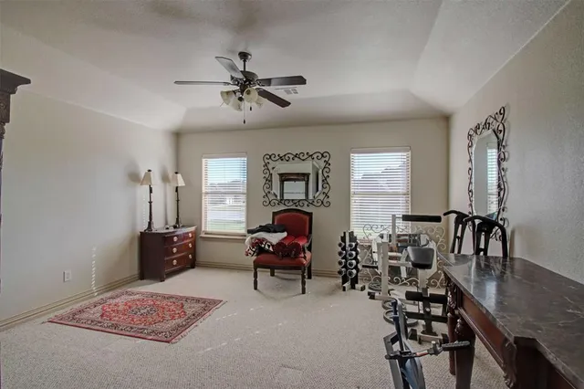 a bedroom with furniture and a chandelier